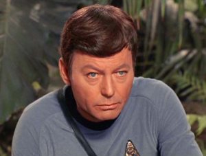 A photo of Dr. Leonard McCoy looking annoyed