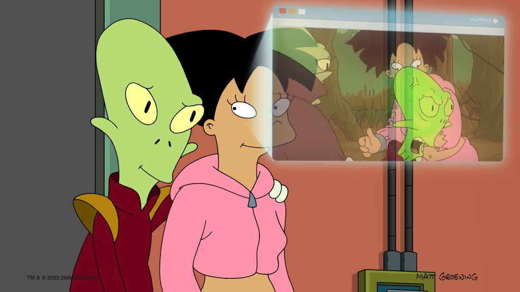 The alien Kif and Amy watch a video of Kif giving birth. 