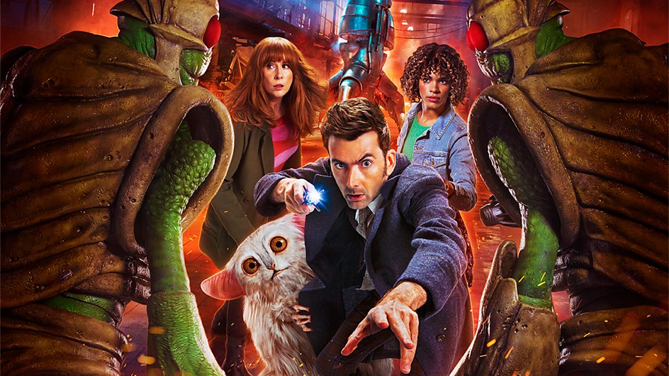 The Fourteenth Doctor, Donna Noble, Rose Noble and Beep the Meep are pictured. They're approached by two armoured green alien foes.