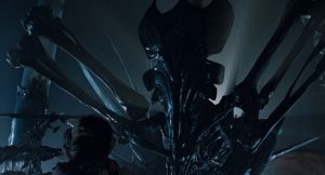 The Alien queen - a huge black alien with long spider-like legs