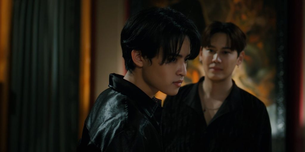 Ramil, out of focus in the background, is staring at Ciar. Ciar is looking angrily off to the side.