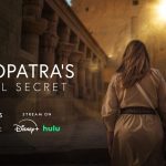 Kathleen Martinez ascends the temple to a bright sun