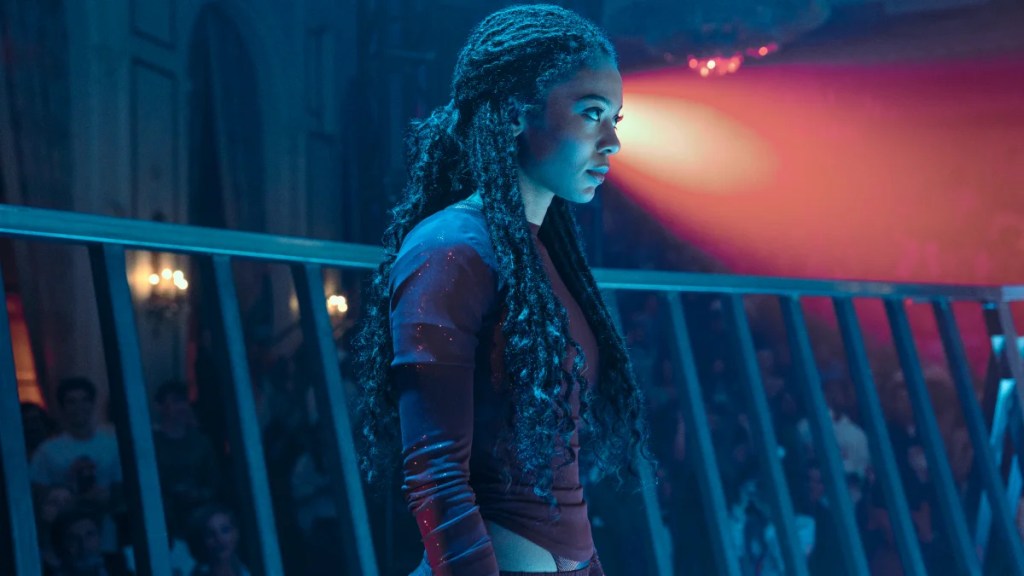 Lit by blue tones, Marie Moreau prepares to fight in an arena. Image courtesy of Amazon Prime Video.