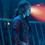 Lit by blue tones, Marie Moreau prepares to fight in an arena. Image courtesy of Amazon Prime Video.