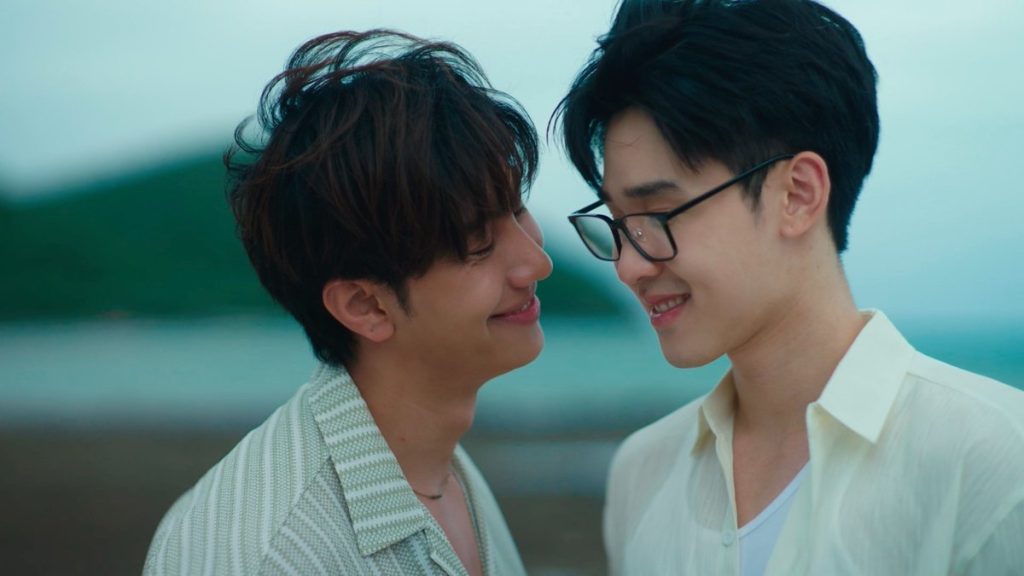 Peng and Wut lean close to each other, smiling.