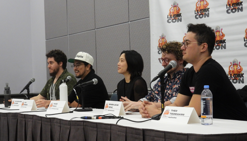 five people sitting behind a table at LA Comic Con