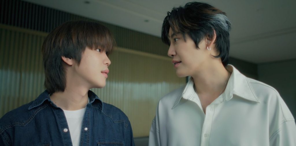 Punn and Ramil smile at each other, about to heading into the painting.