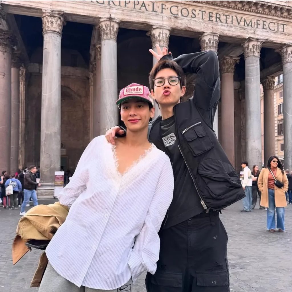 Off and Gun in front of the Parthenon in Rome. Off is puckering his lips and holding one arm behind his head.