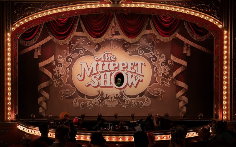A theatre marquee with The Muppet Show on a screen in the middle.. Kermit is in the O. Photo by Mitch Haaseth and used courtesy Disney+.