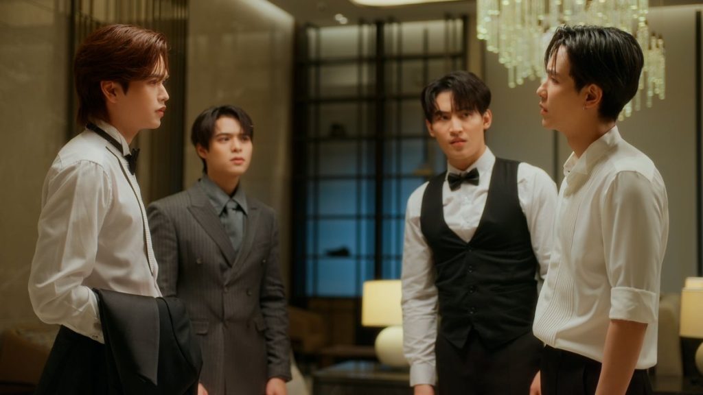 Pai and Tim face off in the hallway, dressed in their wedding suits. Yu and North are behind them, looking at Tim.